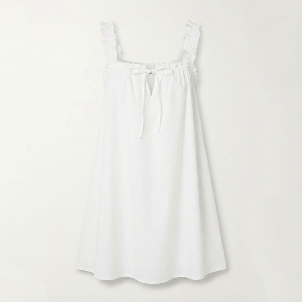White cotton mini slip dress with ruffled straps, square neckline, and a front tie keyhole detail, front view flat lay