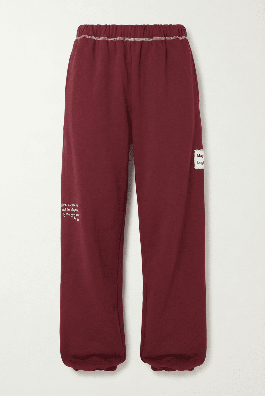 Burgundy cotton blend sweatpants with contrast stitching on the waistband, side text print, and brand patch, front view flat lay