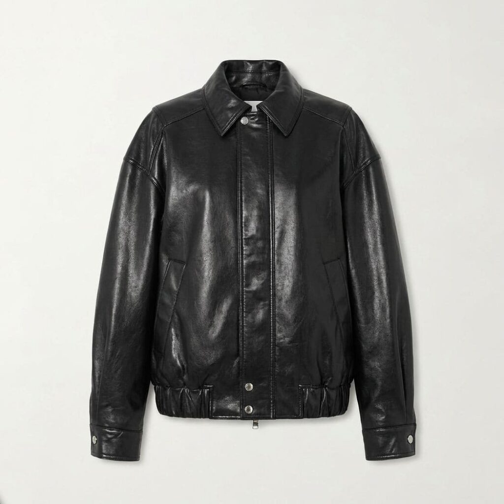 Black oversized leather collared jacket with zip-front and snap-button details, front view flat lay