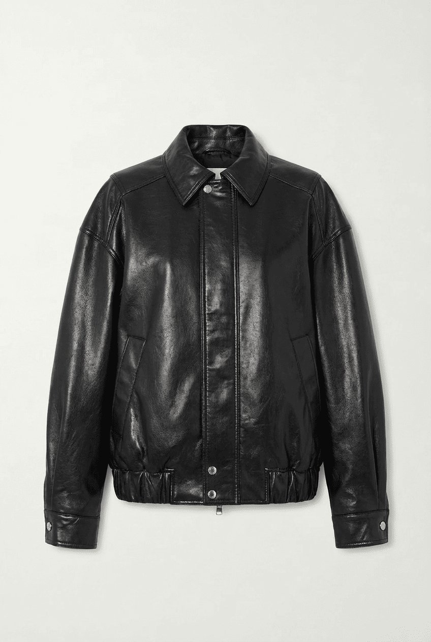 Black oversized leather collared jacket with zip-front and snap-button details, front view flat lay