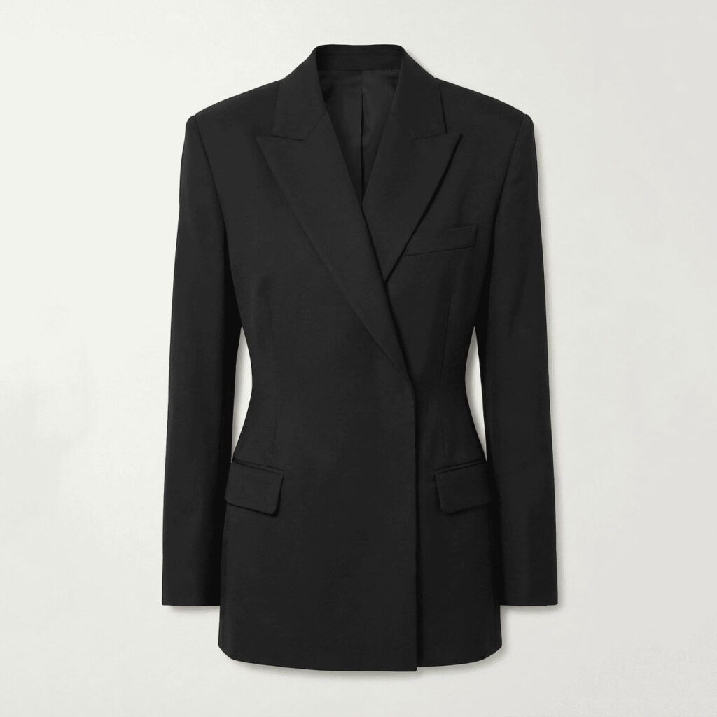 Black waist-cinched tailored blazer with peak lapels, single-breasted closure, and flap pockets, front view flat lay