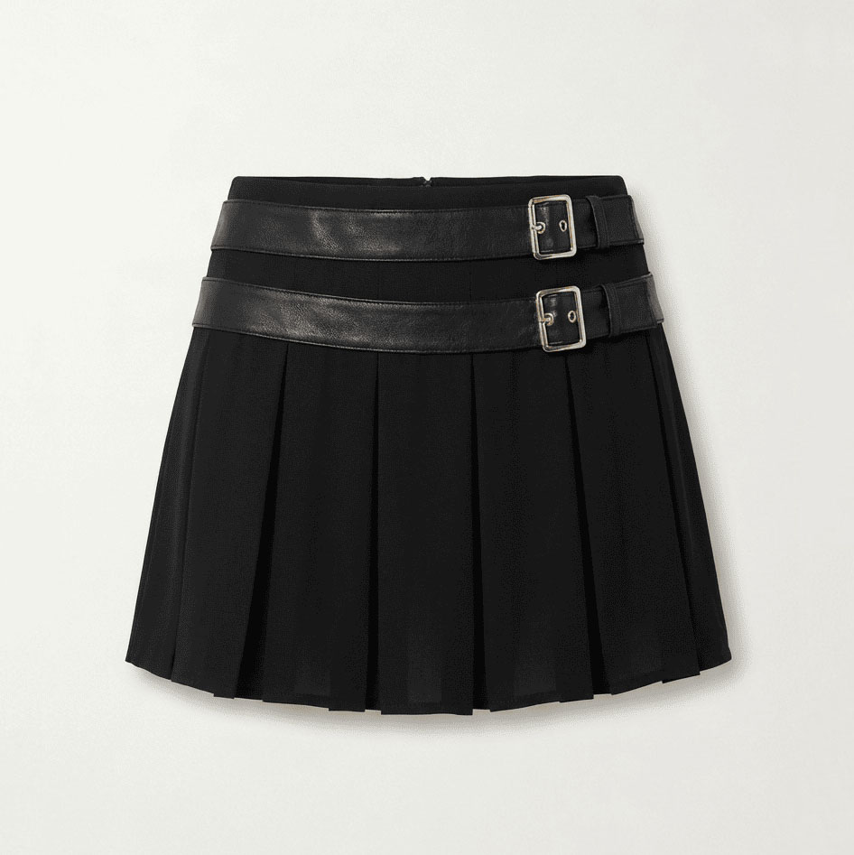 Black pleated mini skirt with double faux leather belt detail, front view flat lay