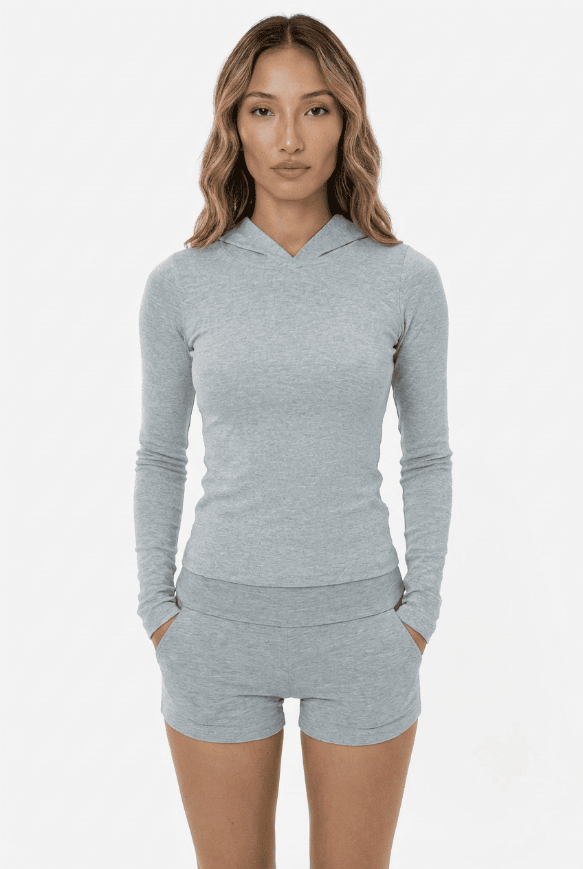 Model wearing heather grey slim-fit hooded long-sleeve top, front view with matching high-waisted shorts