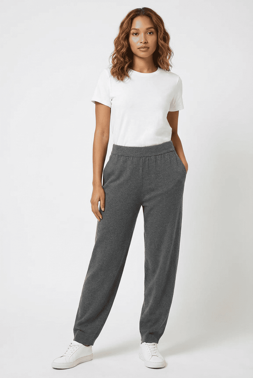 Model wearing heather grey knit jogger pants, front view styled with a white crewneck tee and white sneakers