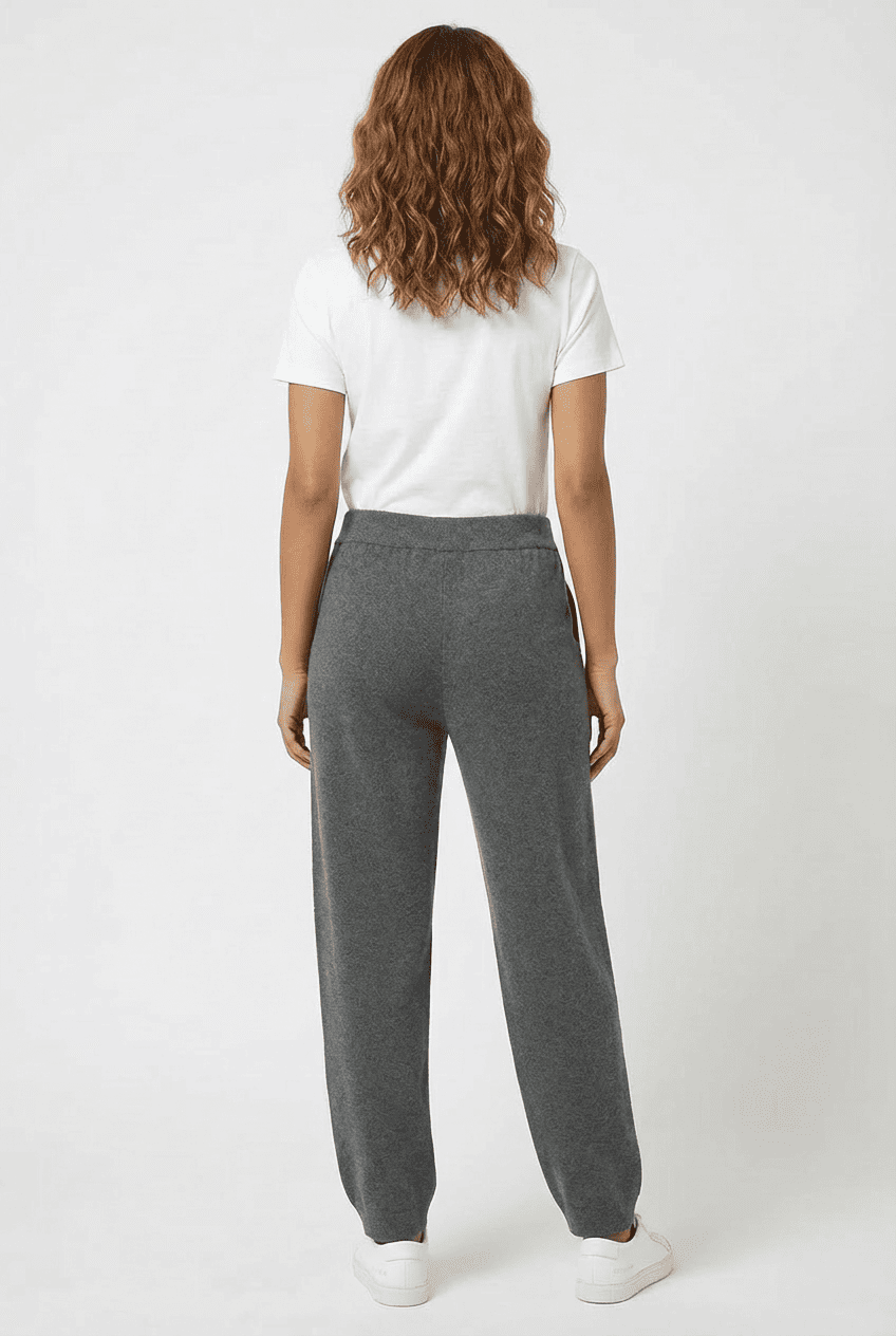 Heather grey knit jogger pants with elasticated waist and tapered cuffs, front view flat lay