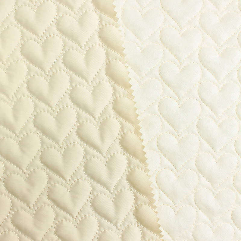 Different color options of heart quilted padded fabric