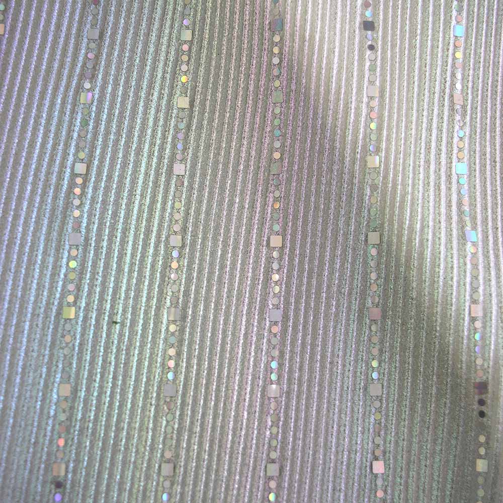 Close-up of pleated mesh fabric with holographic square sequin stripe design