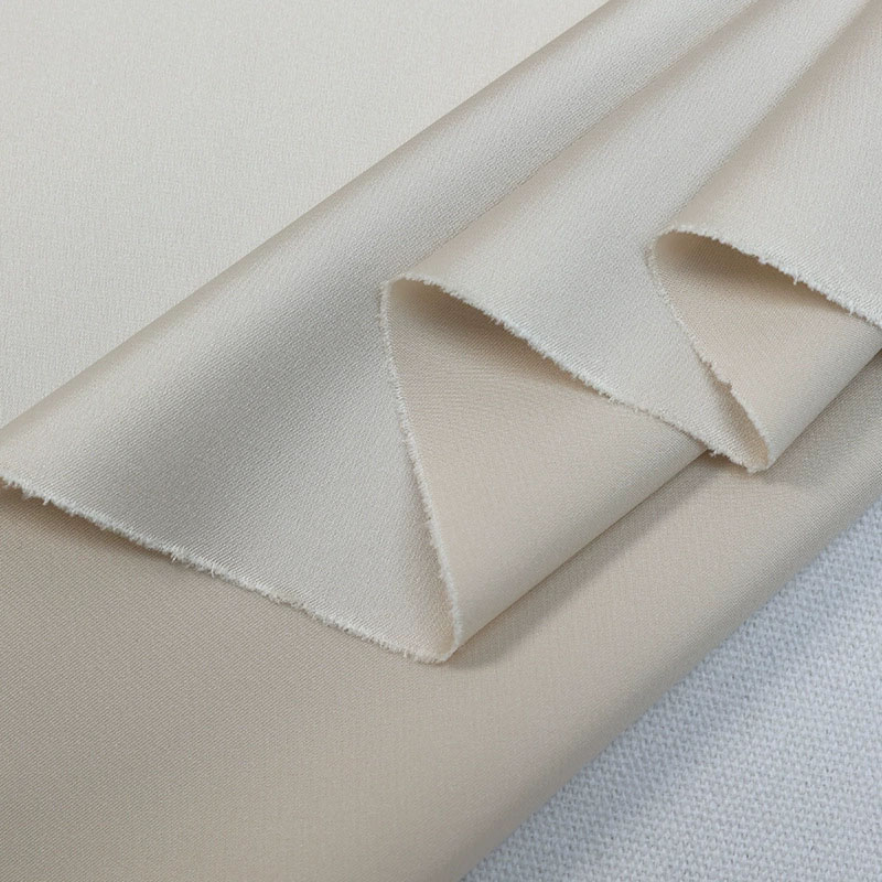 Close-up of imitation silk satin fabric with soft smooth texture