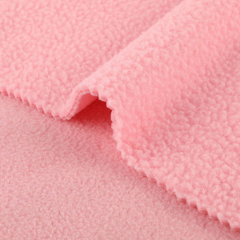 Close-up view of plush sherpa fleece fabric surface texture