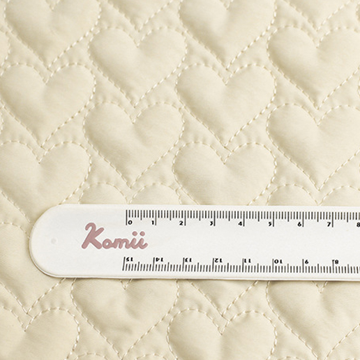 Thickness and scale of padded quilted fabric