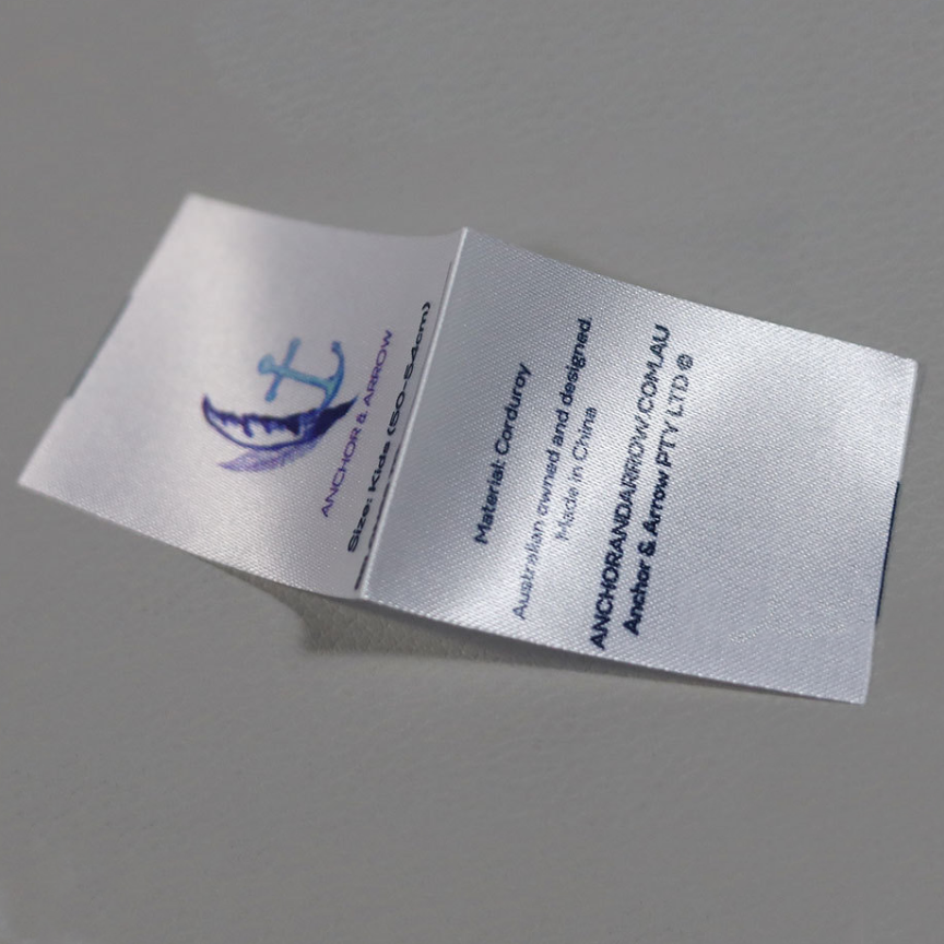 Custom full-color printed fabric labels with logos and artwork